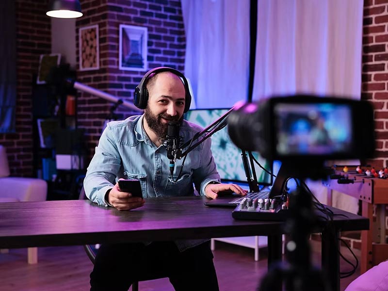 man recording session on camera