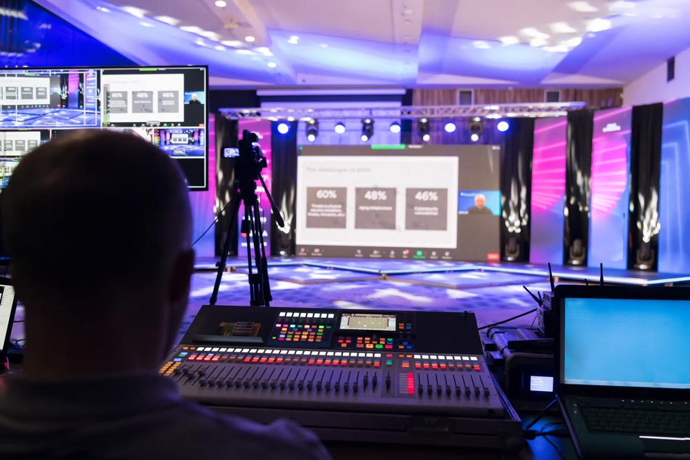 A man operating digital display on a corporate event