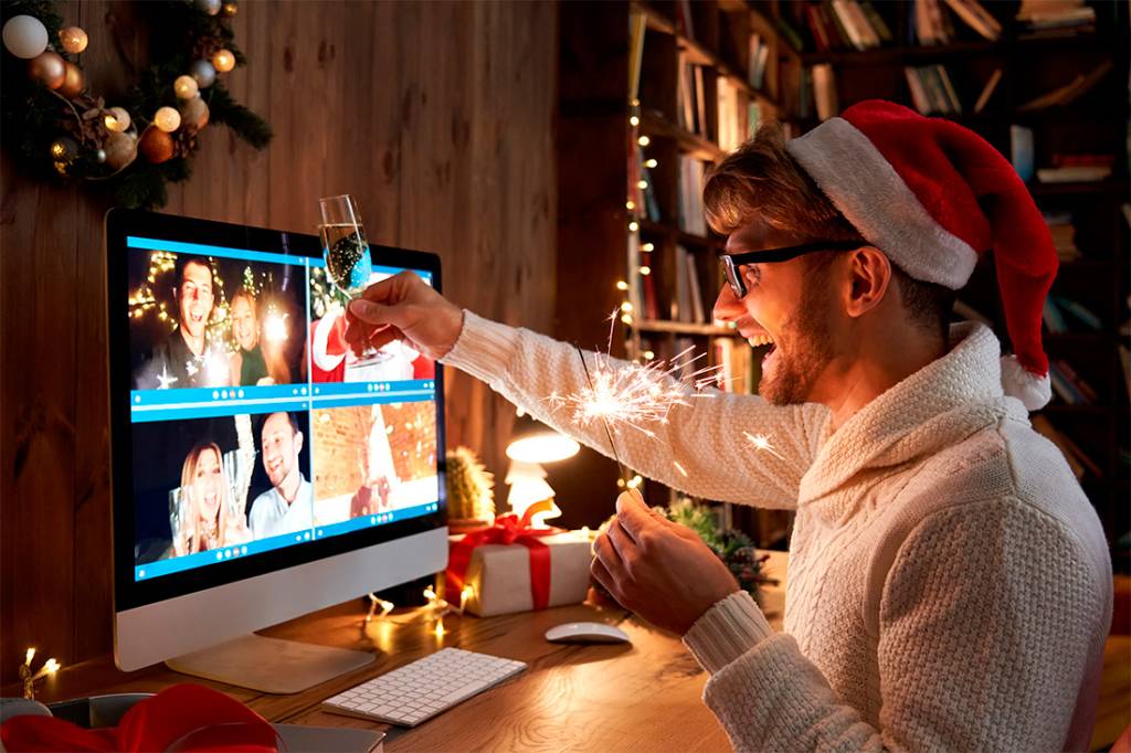 People celebrating Christmas through a video meeting