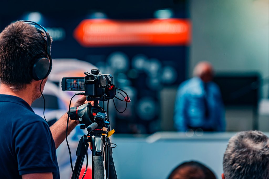 A cameraman recording a event