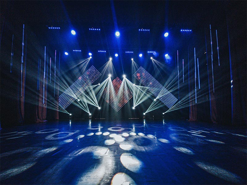 Stage with professional lighting and visual effects.